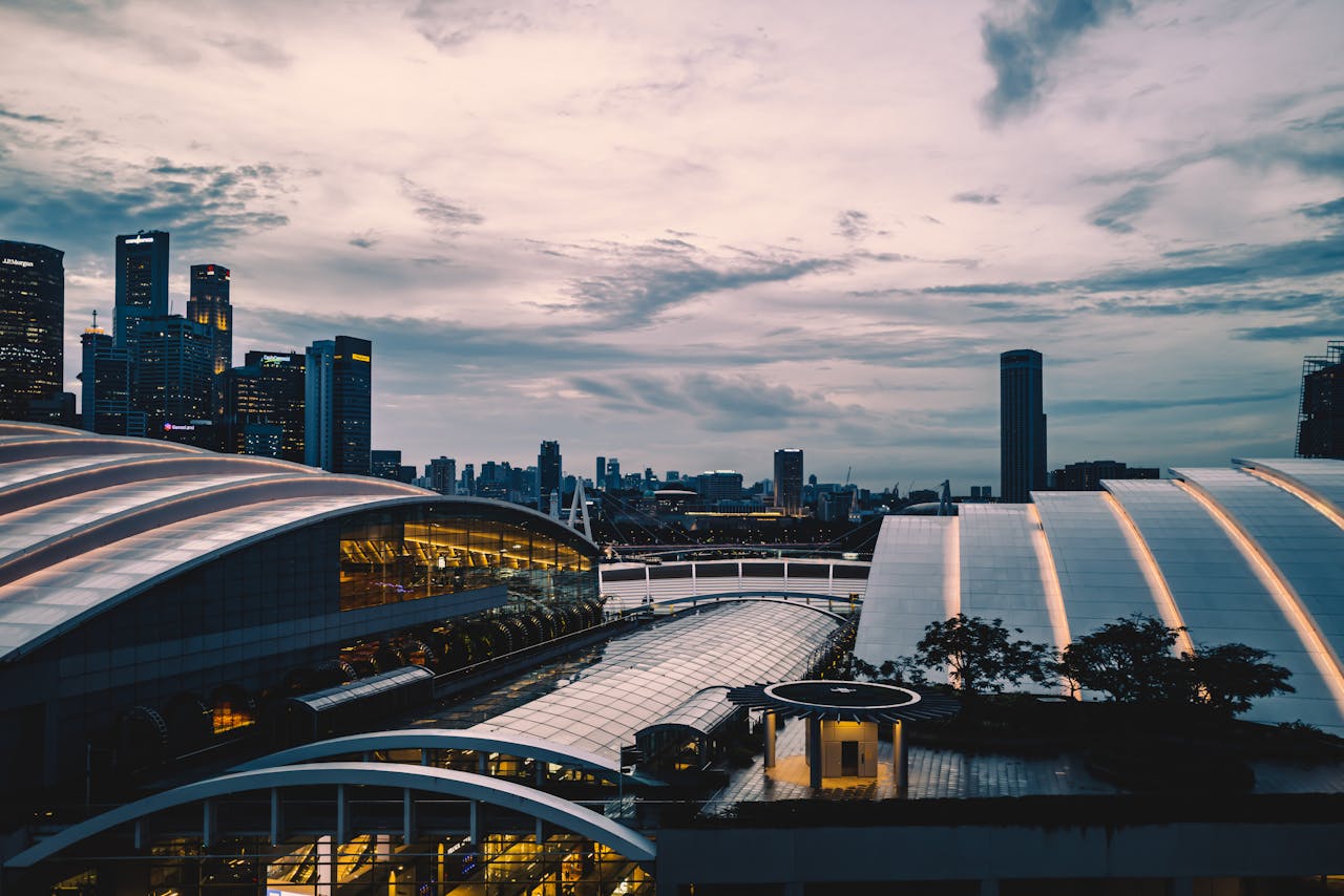 Scenic Singapore city skyline at dusk featuring modern skyscrapers and urban architecture.